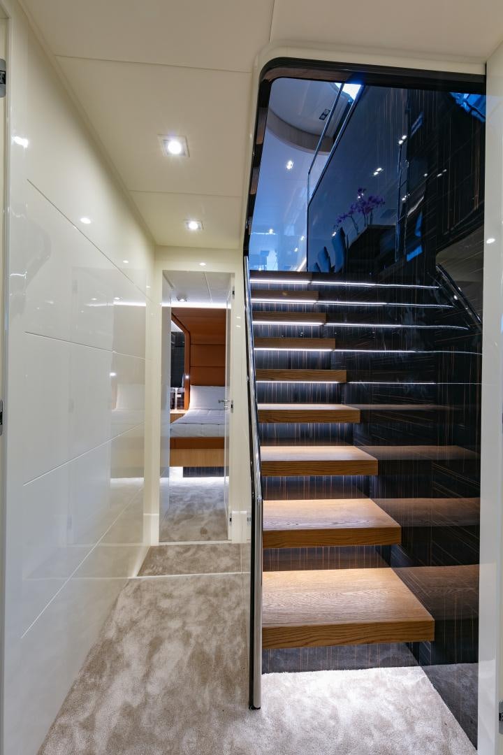 a staircase with glass doors aboard URSUS V Yacht for Sale