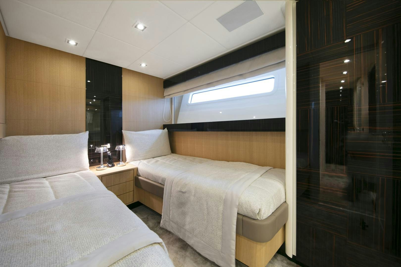 a room with two beds aboard URSUS V Yacht for Sale