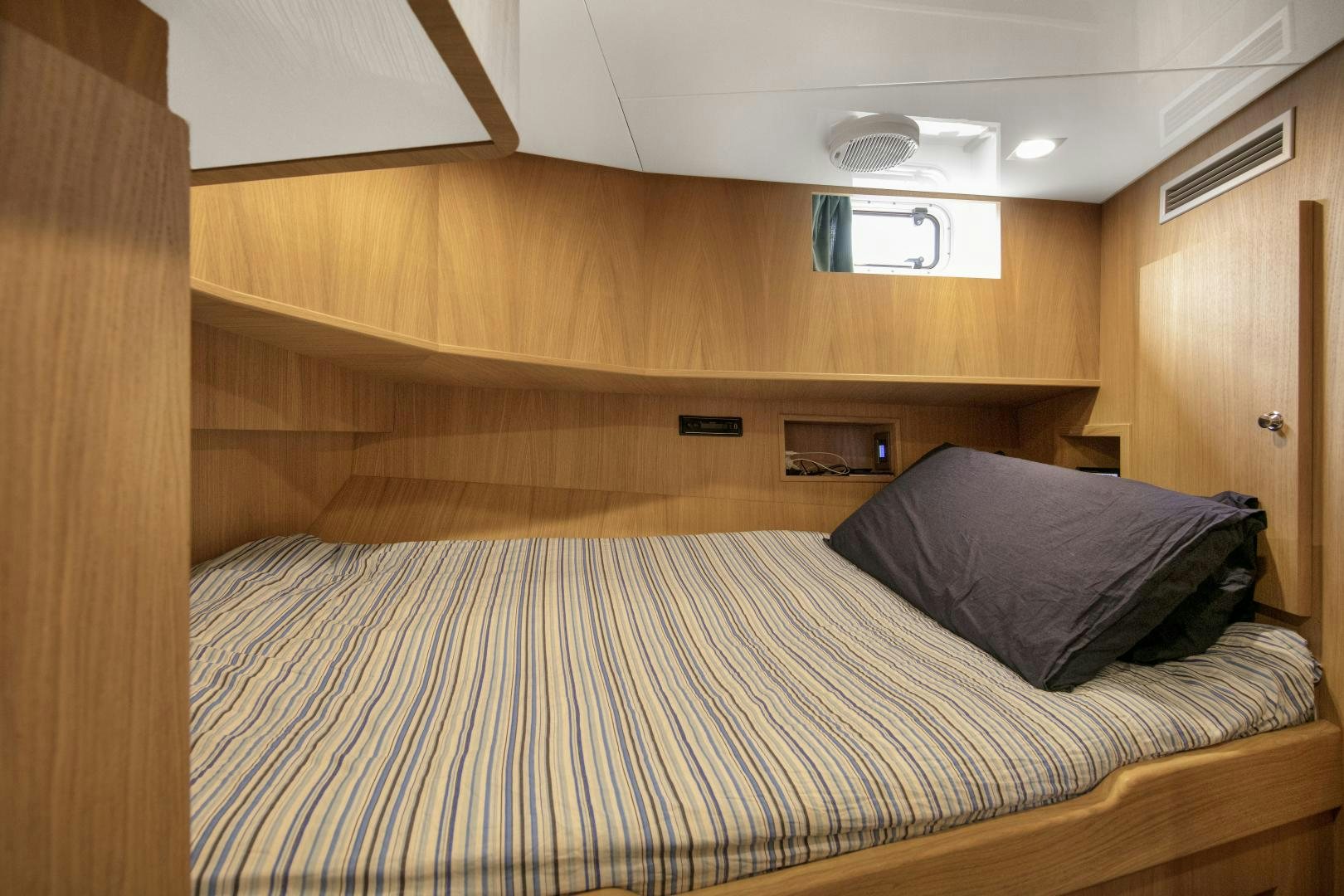a bed in a room aboard URSUS V Yacht for Sale