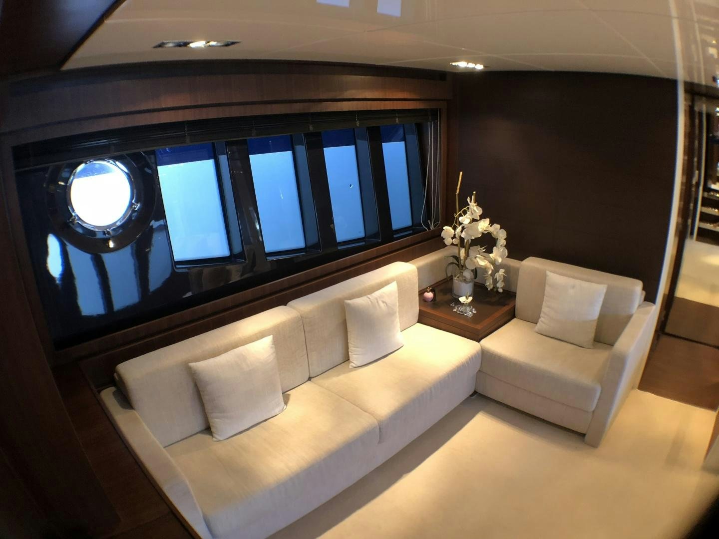 a room with couches and a window aboard MANISCO Yacht for Sale