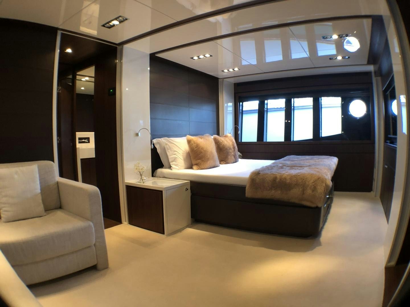 a room with a bed and a couch aboard MANISCO Yacht for Sale