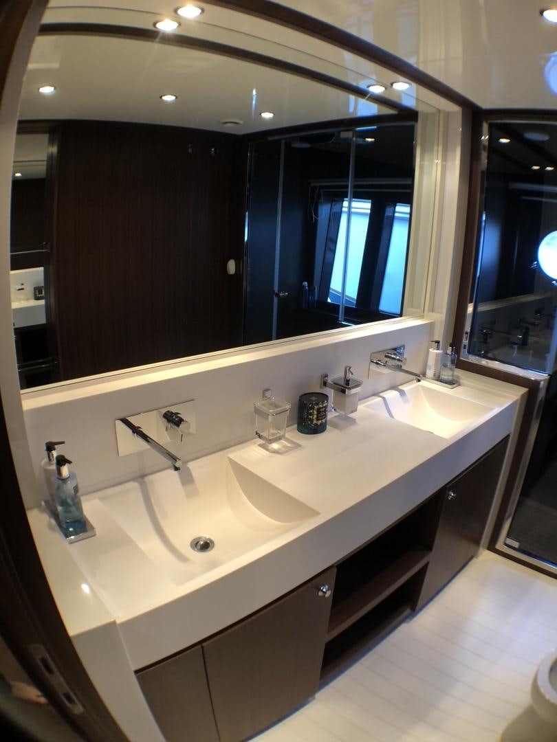 a bathroom with a large mirror aboard MANISCO Yacht for Sale