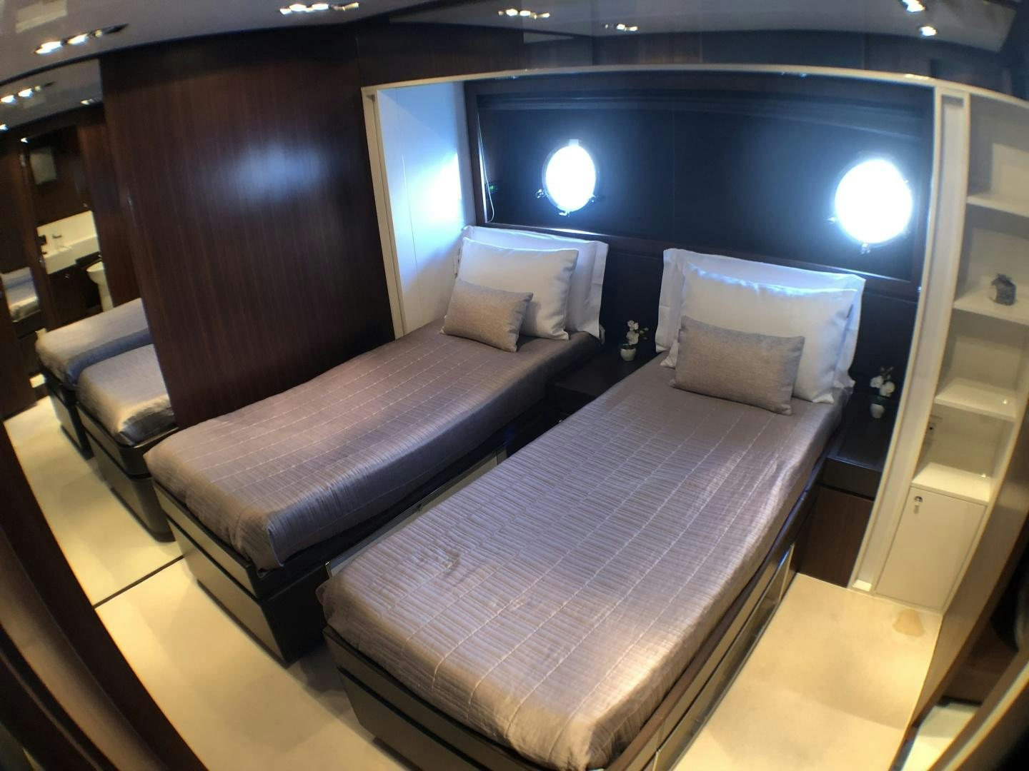 a room with a bed and a couch aboard MANISCO Yacht for Sale