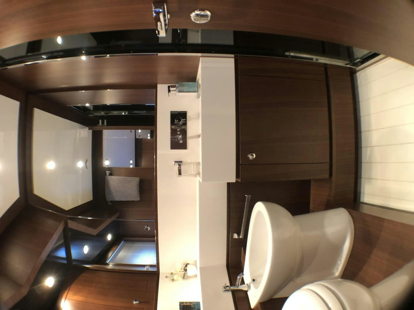a bathroom with a toilet and a sink aboard MANISCO Yacht for Sale