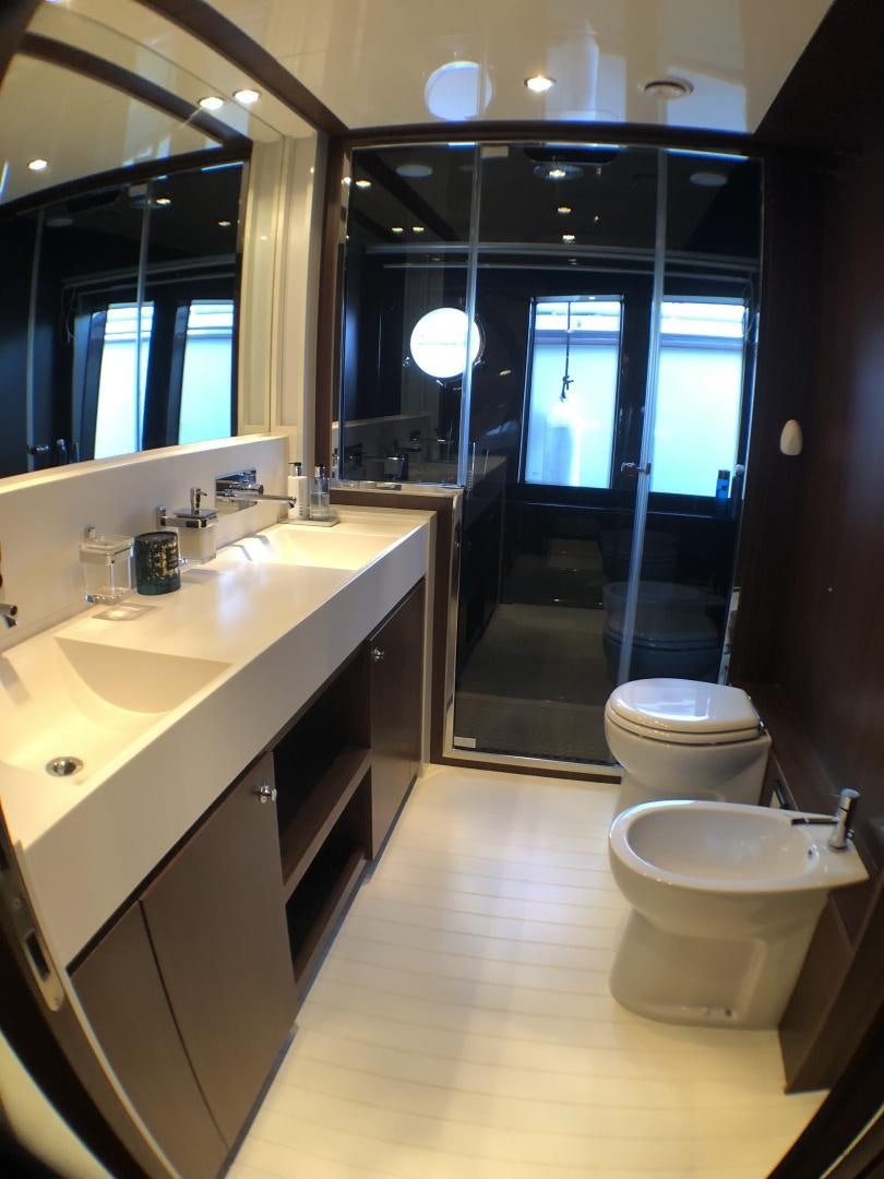 a bathroom with a large mirror aboard MANISCO Yacht for Sale