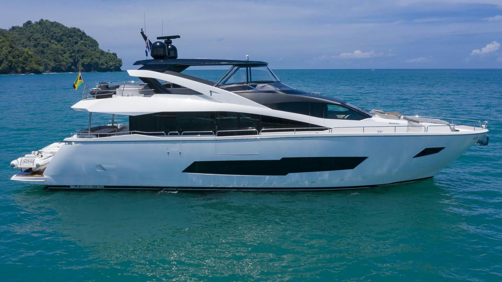 a white yacht in the water aboard PURA VIDA Yacht for Sale