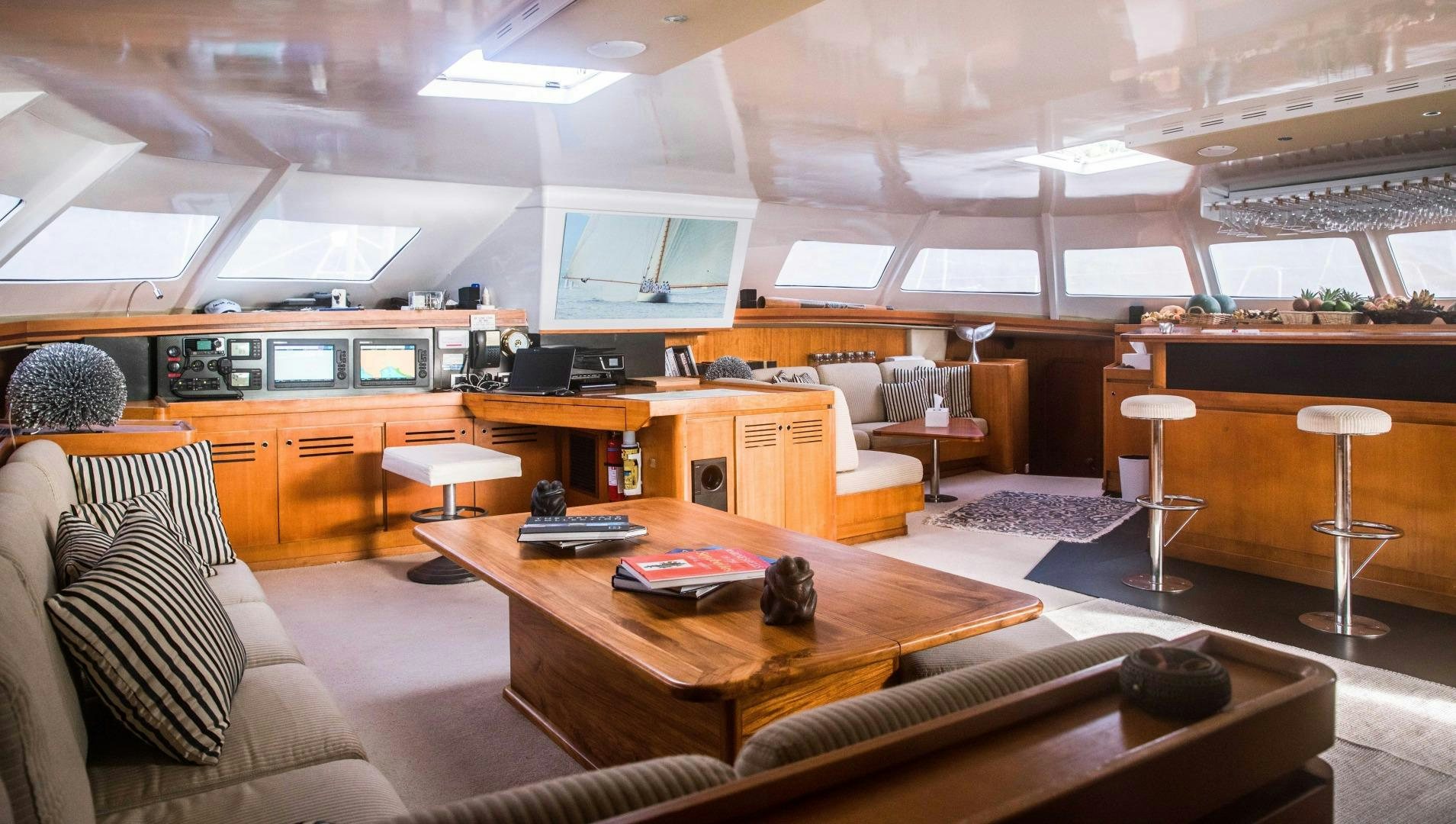 a room with a couch and a table and chairs aboard LONESTAR Yacht for Sale