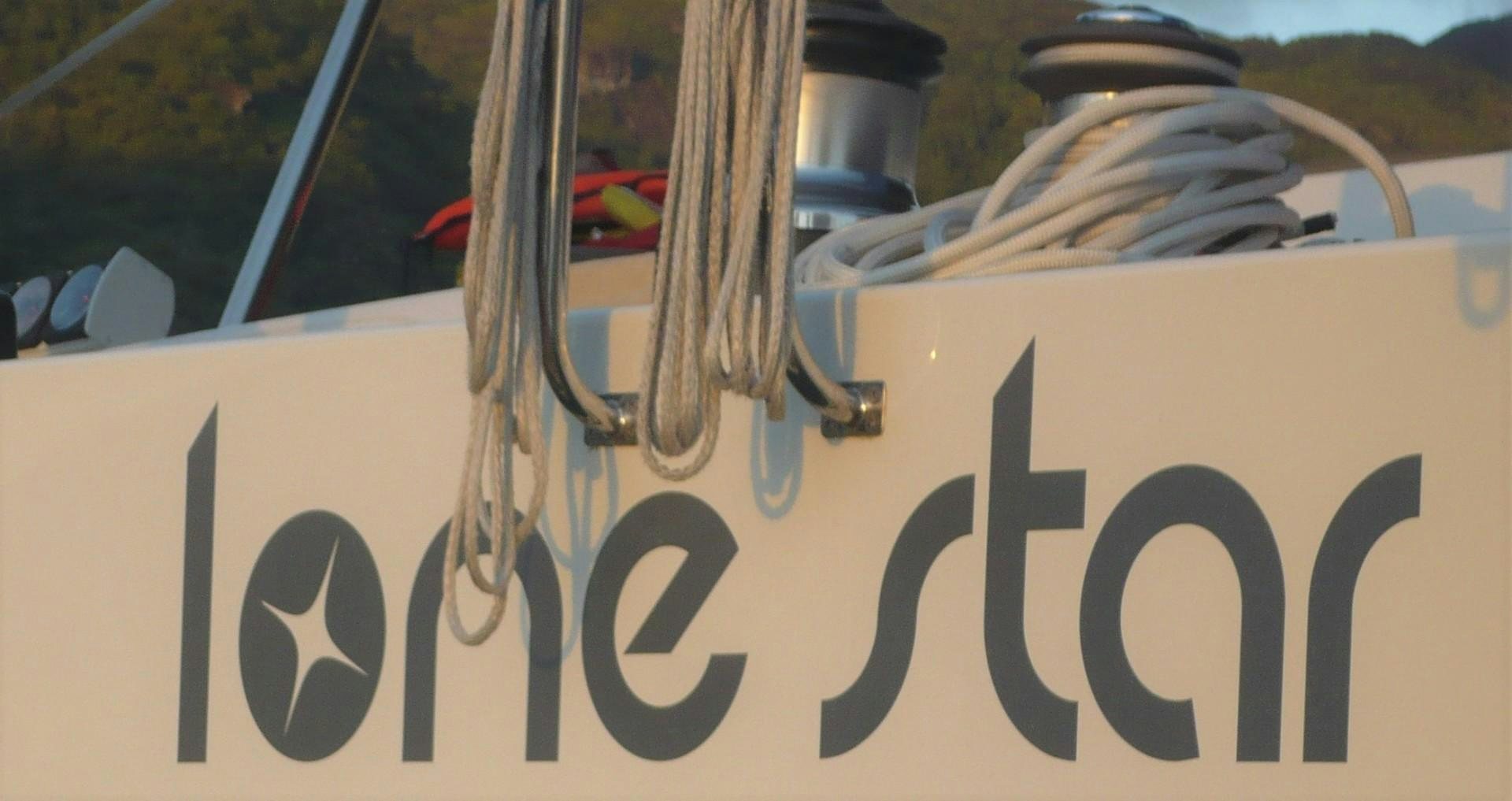 a yellow sign with a red and white ribbon on it aboard LONESTAR Yacht for Sale
