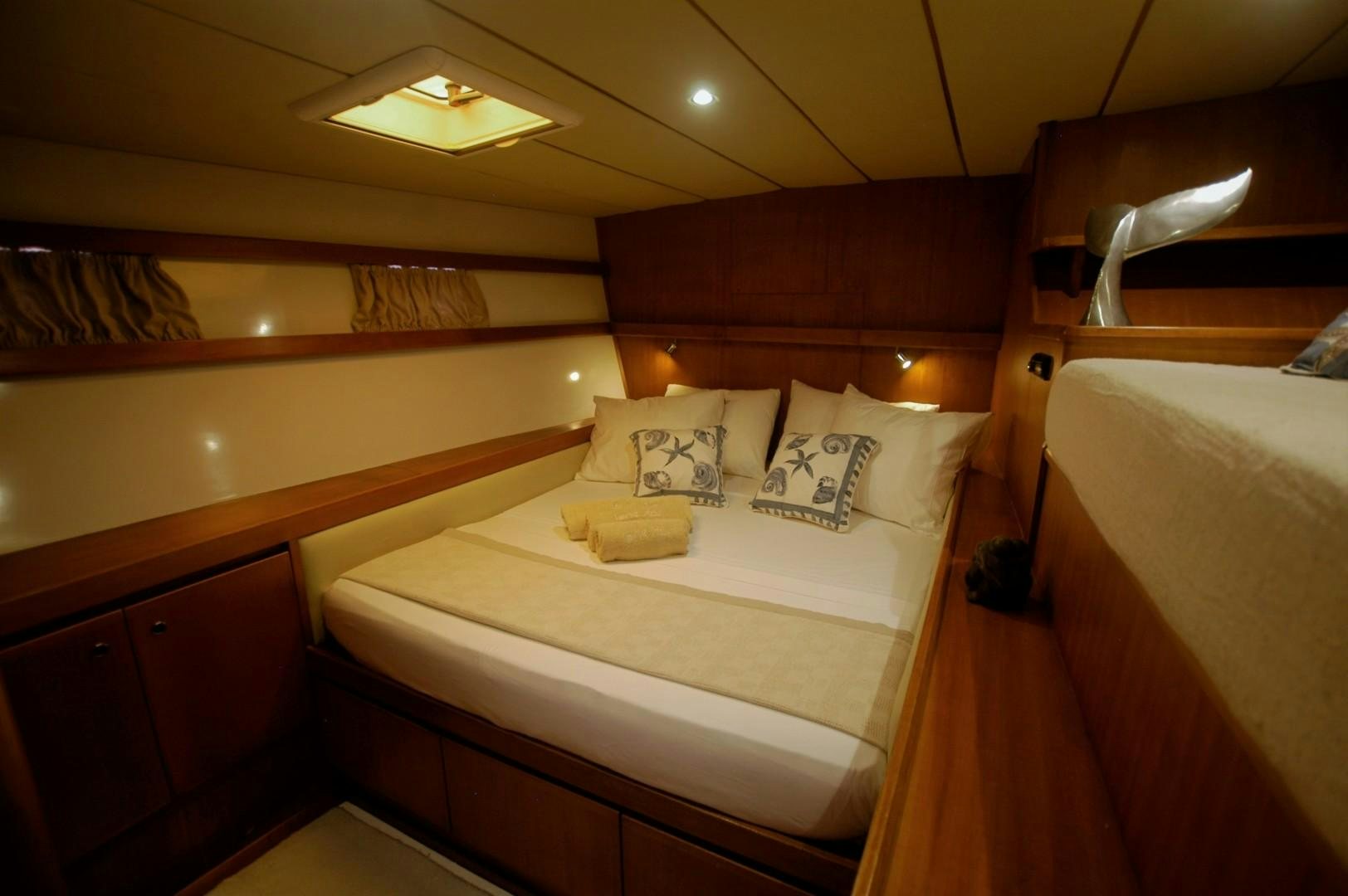a room with two beds aboard LONESTAR Yacht for Sale
