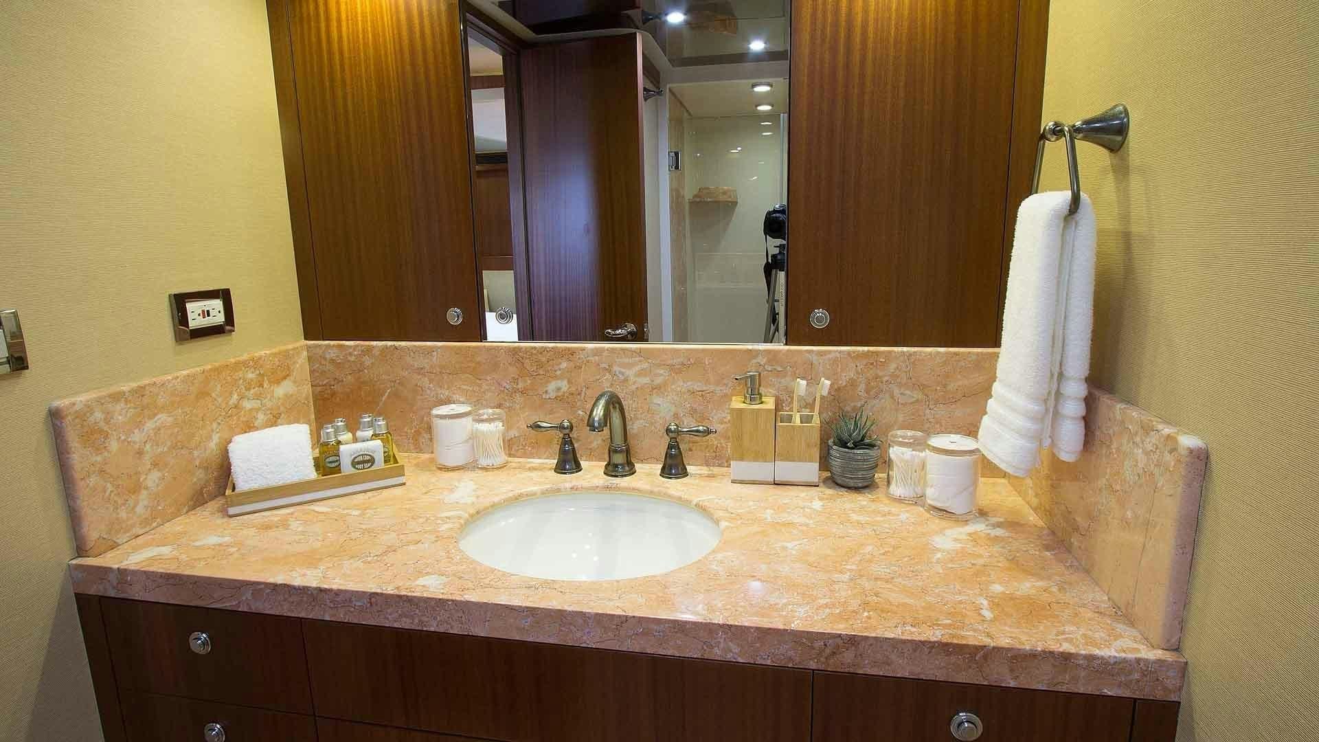 a bathroom with a large mirror aboard JUS CHILL'N Yacht for Sale