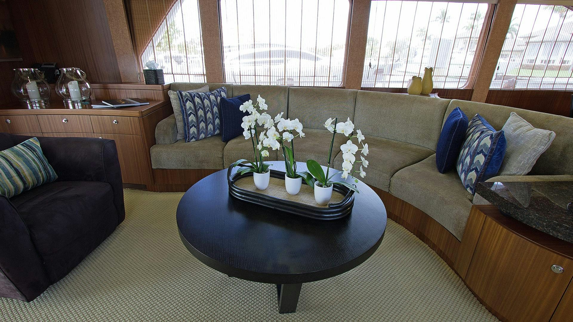 a living room with a couch and a coffee table aboard JUS CHILL'N Yacht for Sale