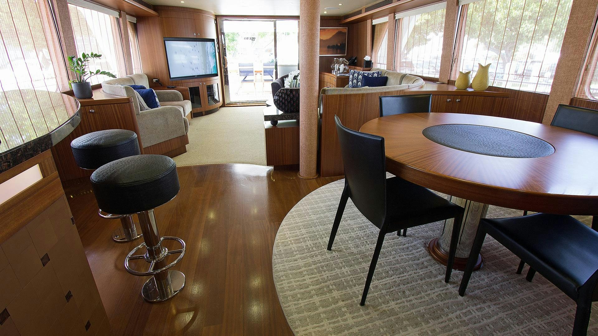 a room with a table and chairs aboard JUS CHILL'N Yacht for Sale