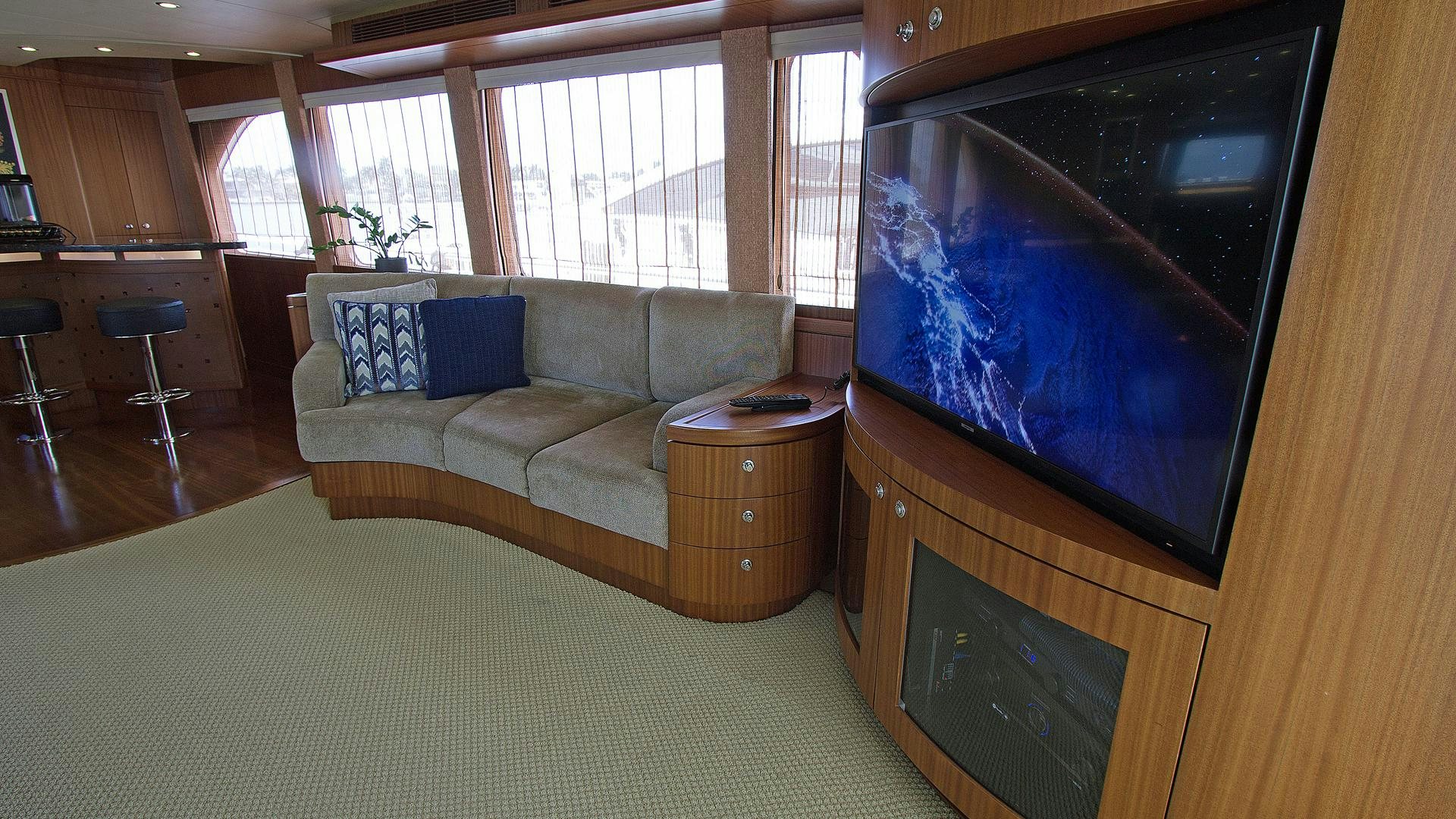 a living room with a couch and a tv aboard JUS CHILL'N Yacht for Sale