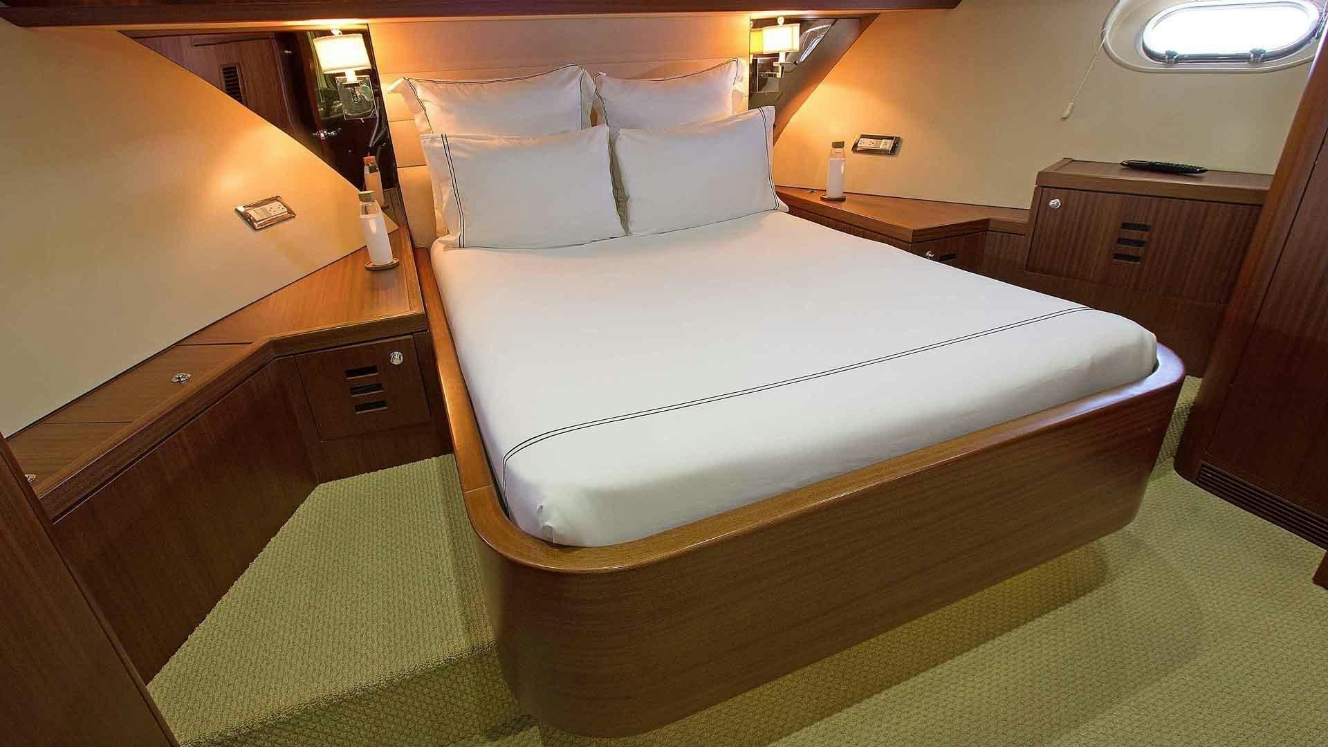 a bed in a room aboard JUS CHILL'N Yacht for Sale