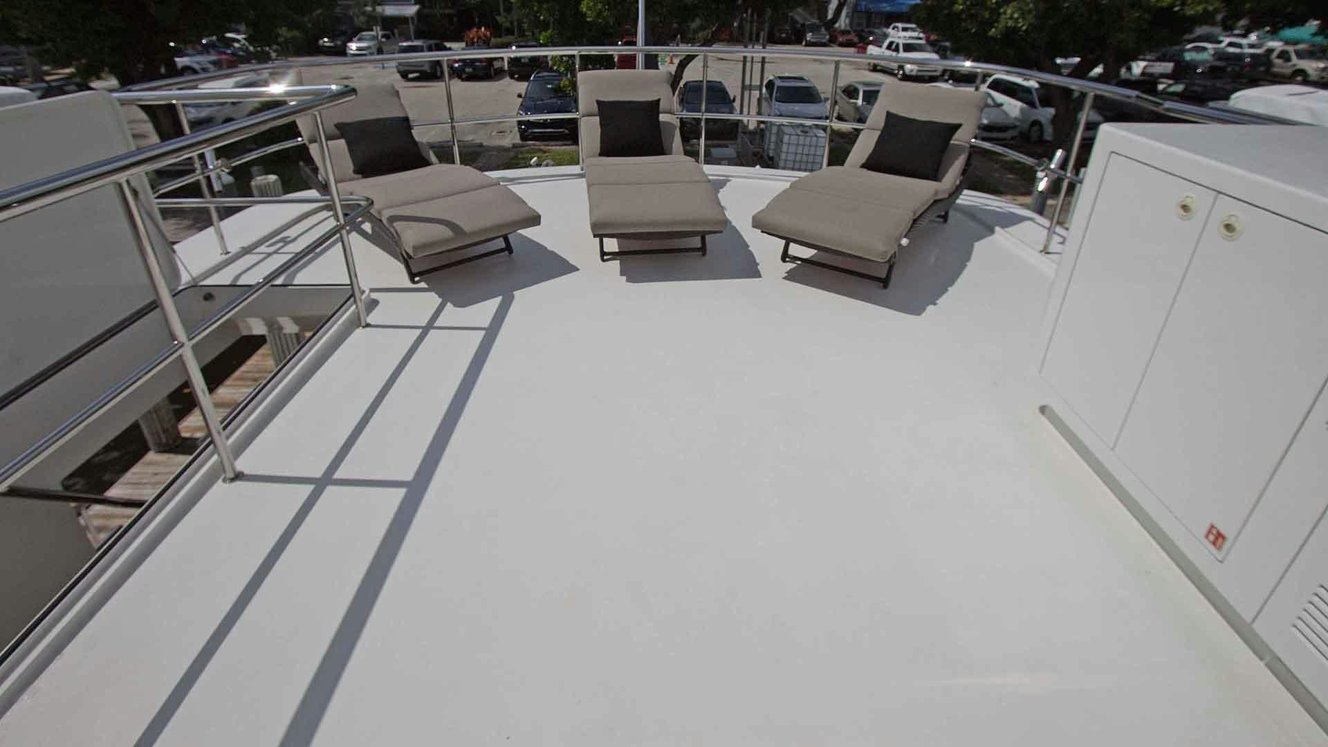 a group of chairs on a deck aboard JUS CHILL'N Yacht for Sale