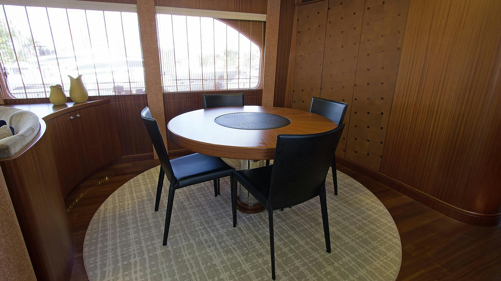 a table and chairs in a room aboard JUS CHILL'N Yacht for Sale