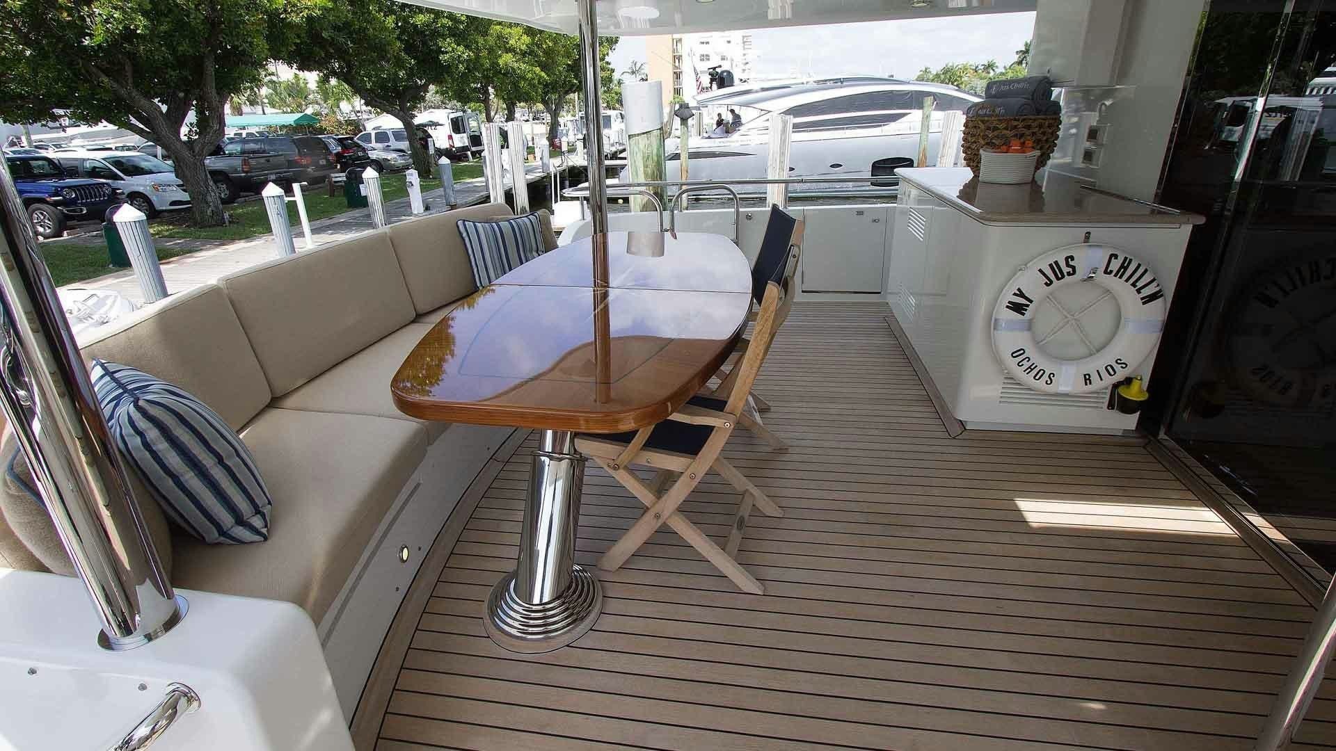 a table and chairs outside a restaurant aboard JUS CHILL'N Yacht for Sale