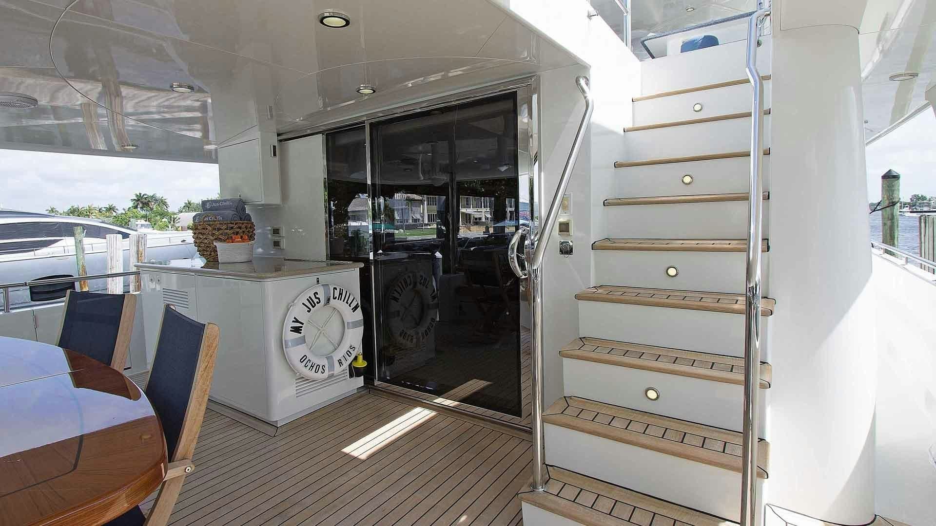 a room with a large glass door aboard JUS CHILL'N Yacht for Sale