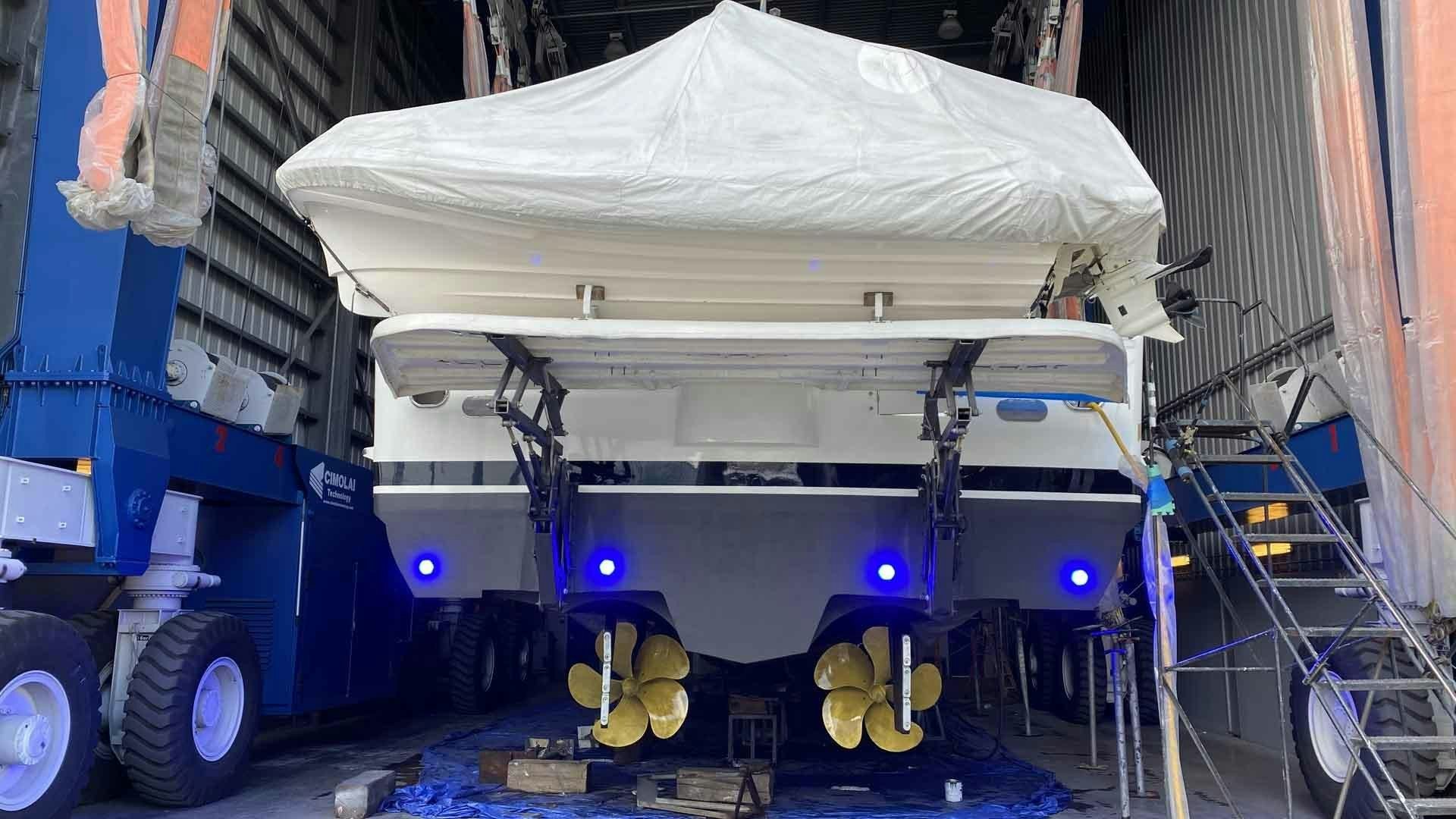 a large blue truck with a white canopy aboard JUS CHILL'N Yacht for Sale