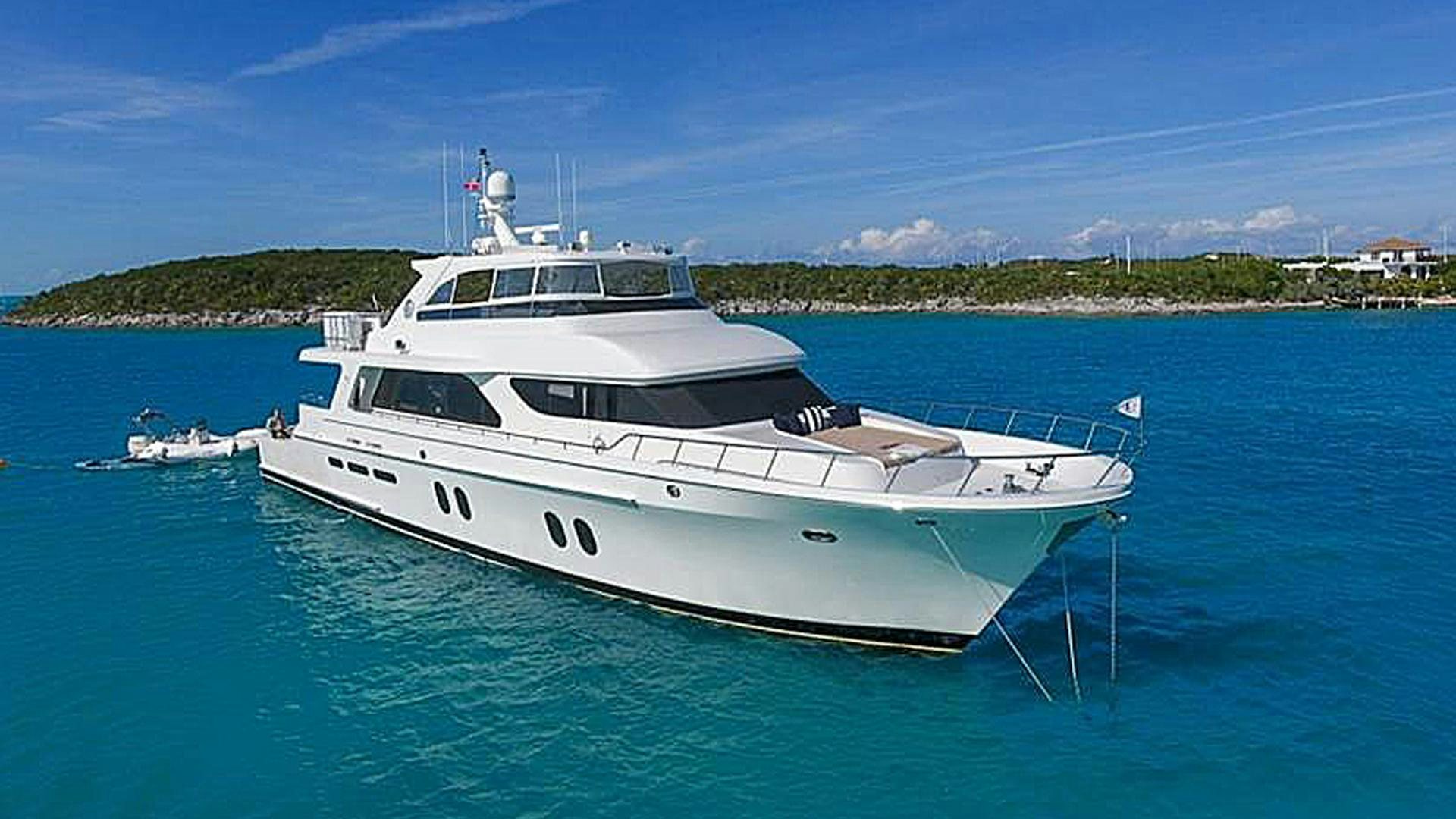 a white boat in the water aboard JUS CHILL'N Yacht for Sale