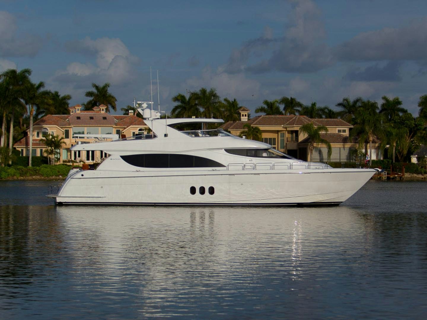 a white yacht in the water aboard ILLUMINIATION Yacht for Sale