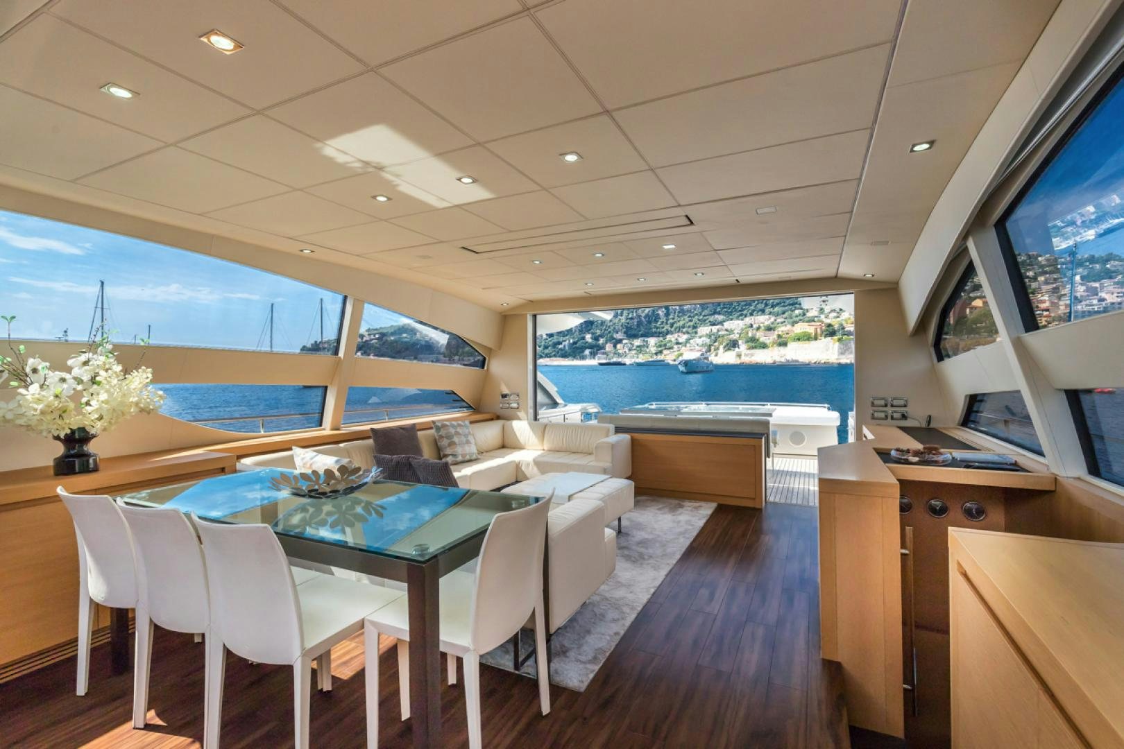 a room with a table and chairs aboard LOUNOR Yacht for Sale