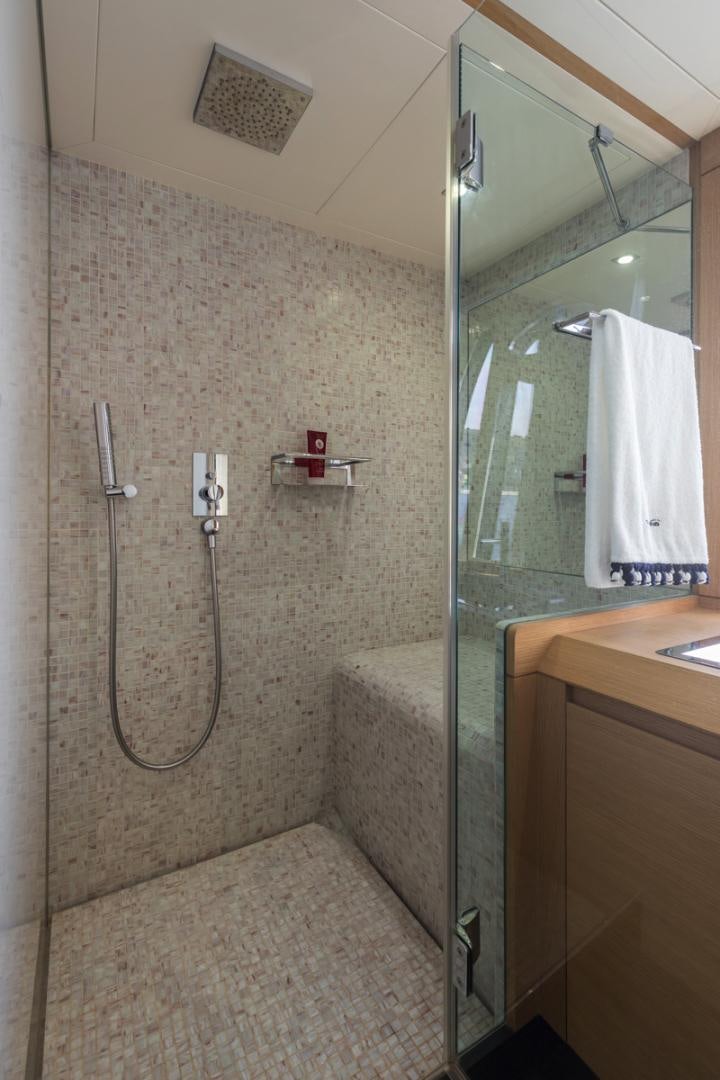 a bathroom with a shower unit and a sink aboard LOUNOR Yacht for Sale
