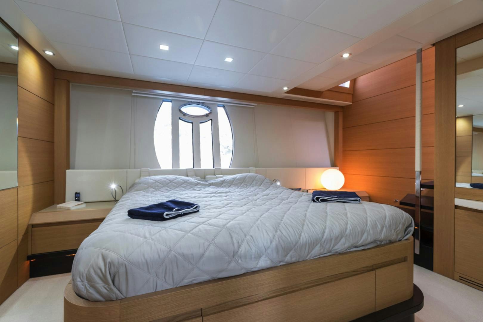 a bedroom with a large bed aboard LOUNOR Yacht for Sale