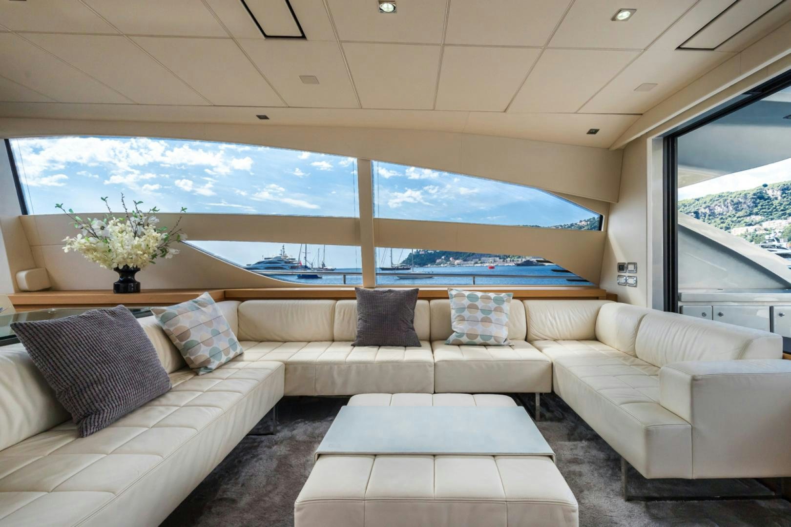 a living room with a large window aboard LOUNOR Yacht for Sale