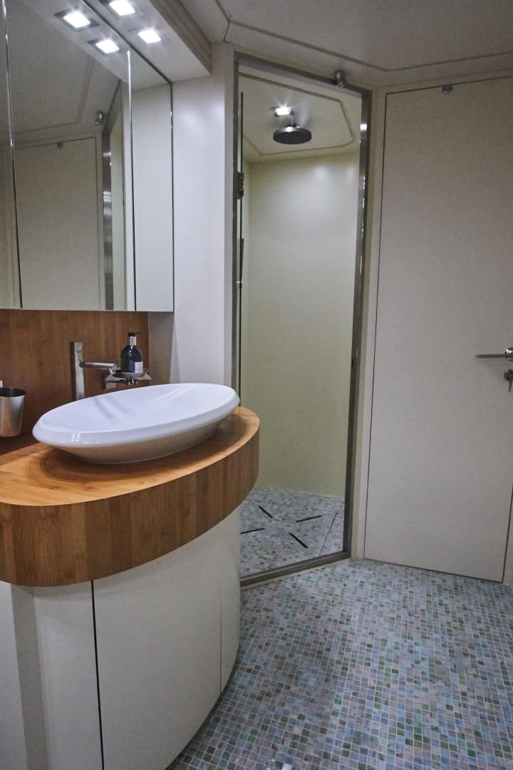 a bathroom with a sink and a mirror aboard SYBER Yacht for Sale