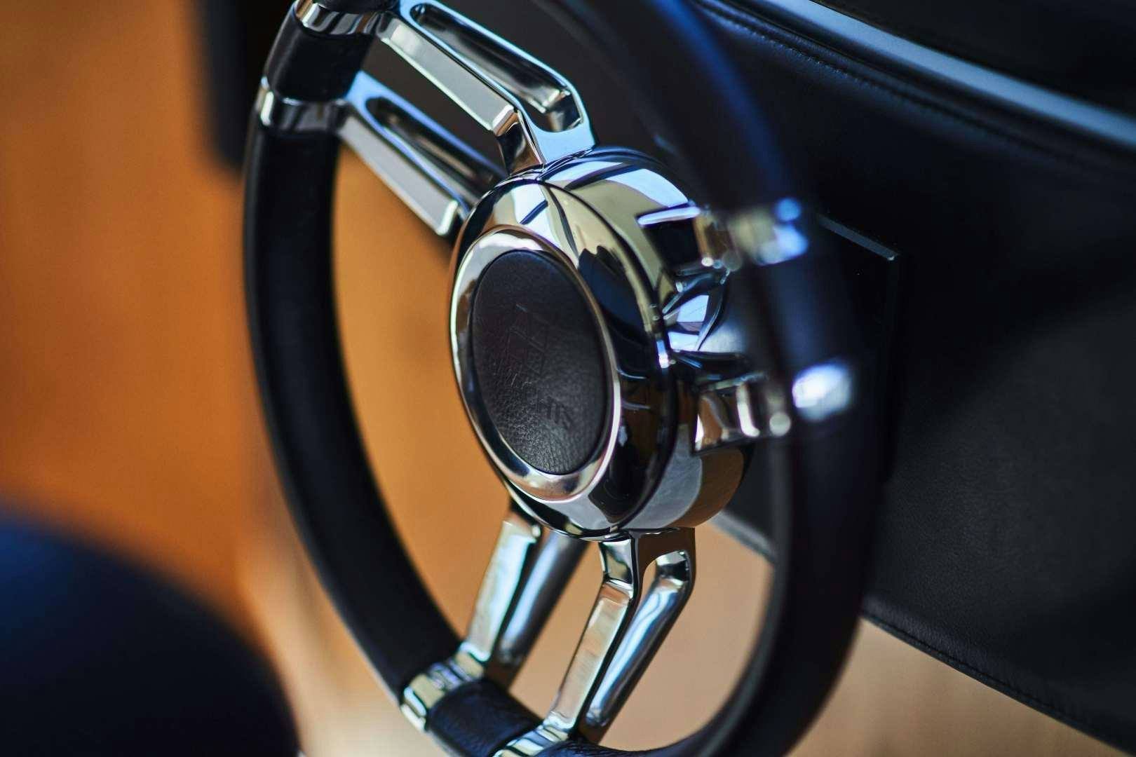 a black headphones on a black surface aboard SYBER Yacht for Sale