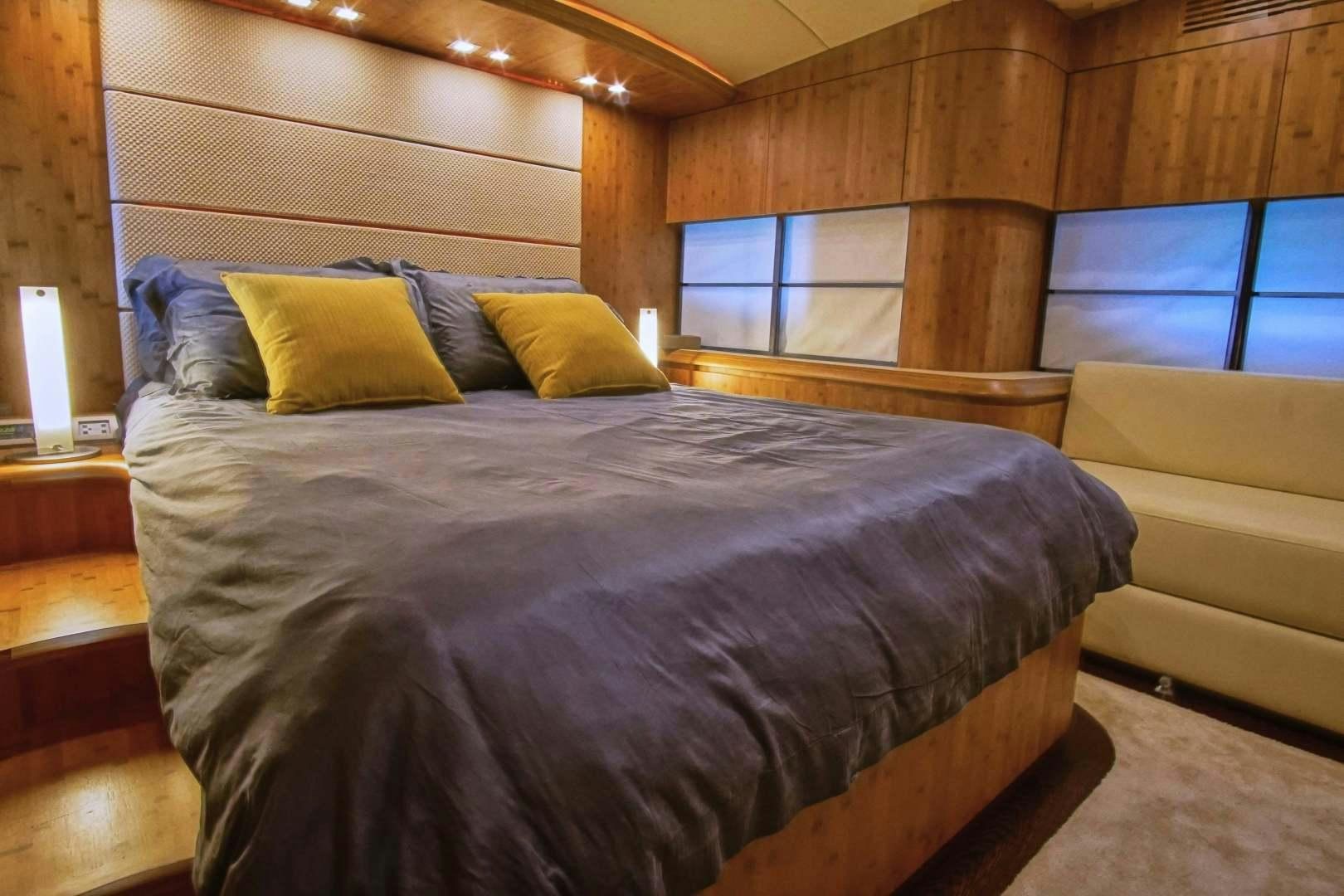 a bed in a room aboard SYBER Yacht for Sale