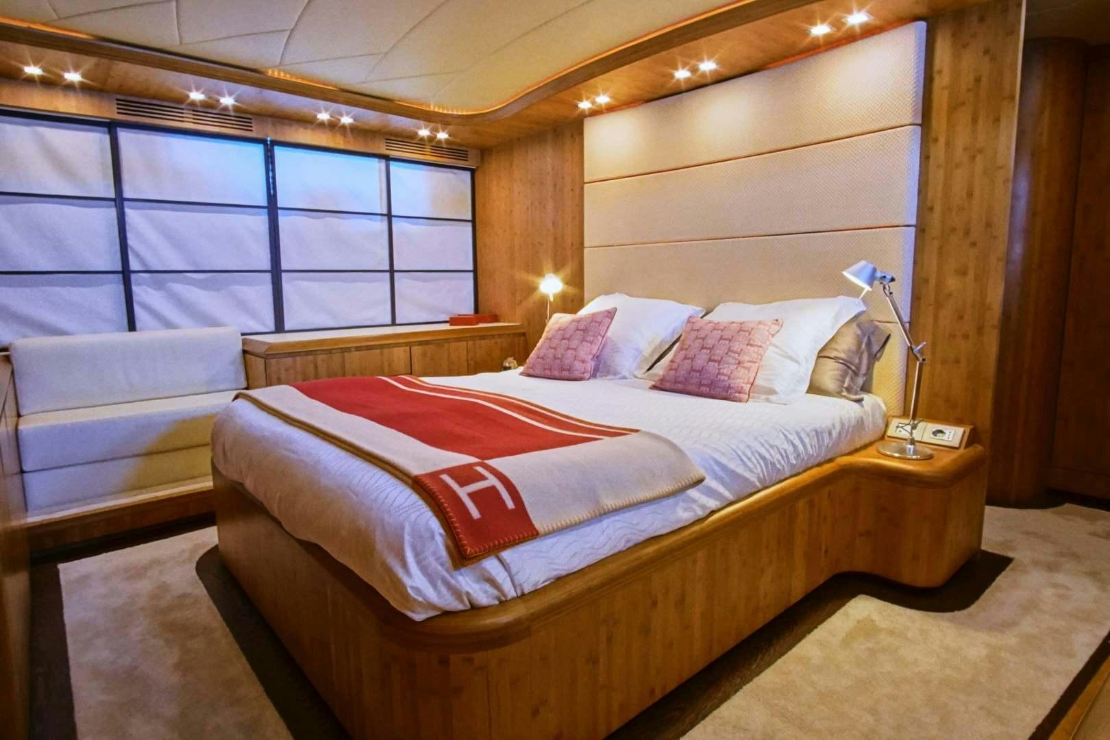 a bed in a room aboard SYBER Yacht for Sale