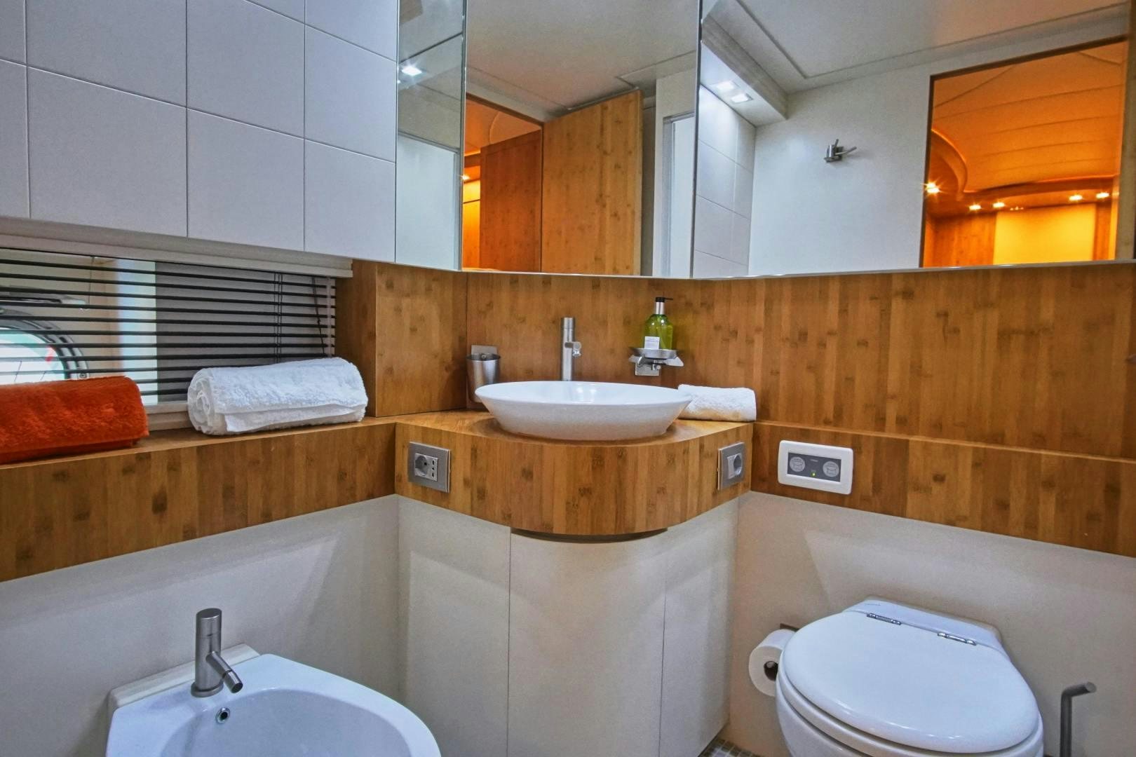 a bathroom with a sink and a toilet aboard SYBER Yacht for Sale