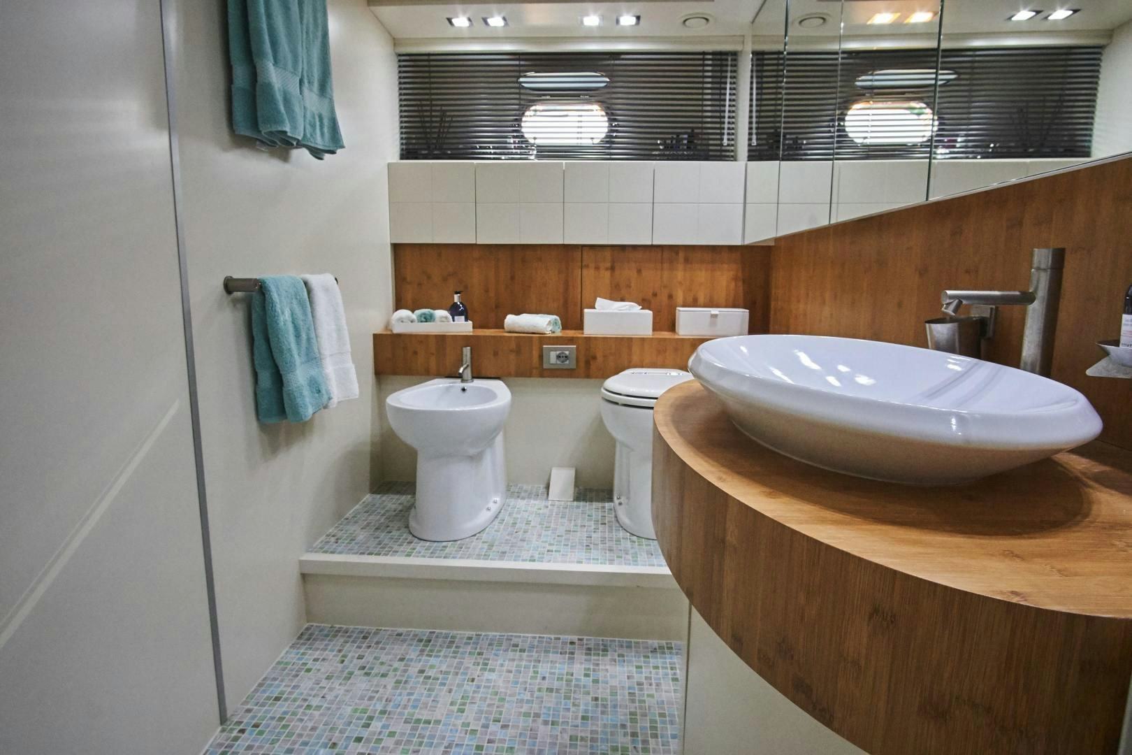 a bathroom with a sink and toilet aboard SYBER Yacht for Sale