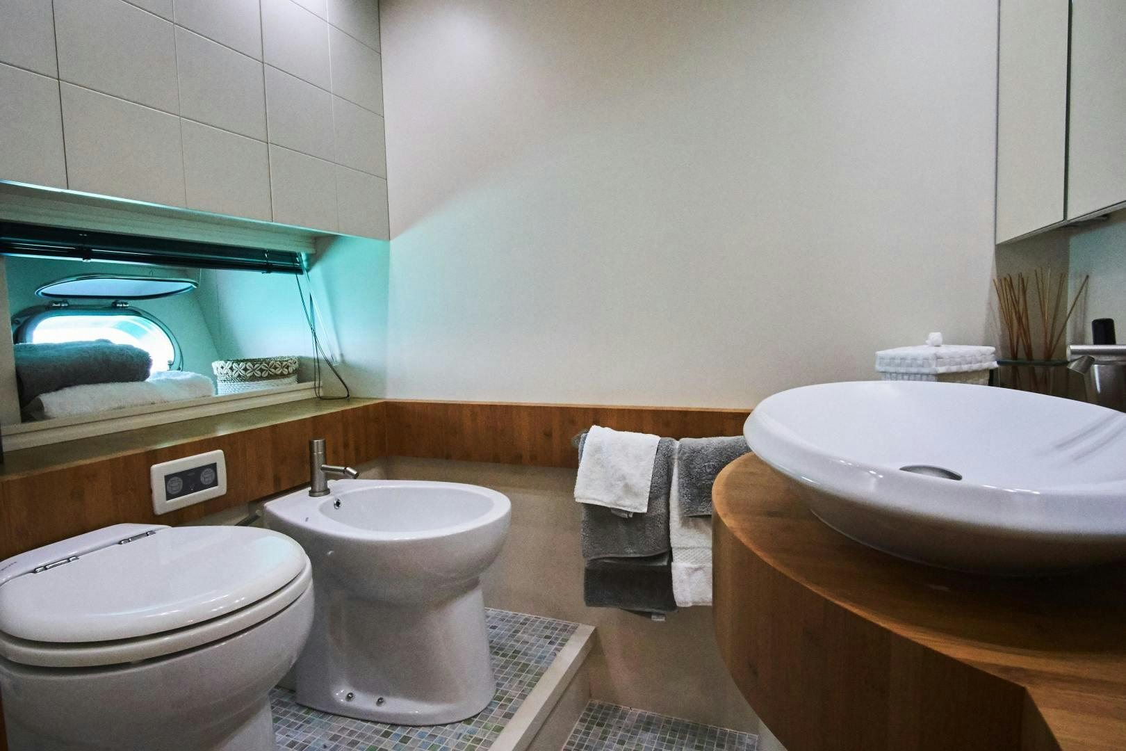 a bathroom with a sink and toilet aboard SYBER Yacht for Sale