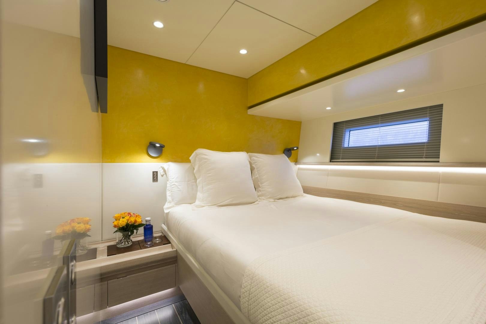 a bed with white sheets aboard BILL & ME Yacht for Sale