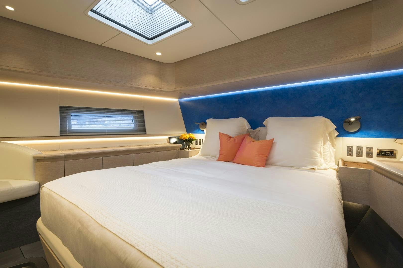 a room with a bed and a television aboard BILL & ME Yacht for Sale