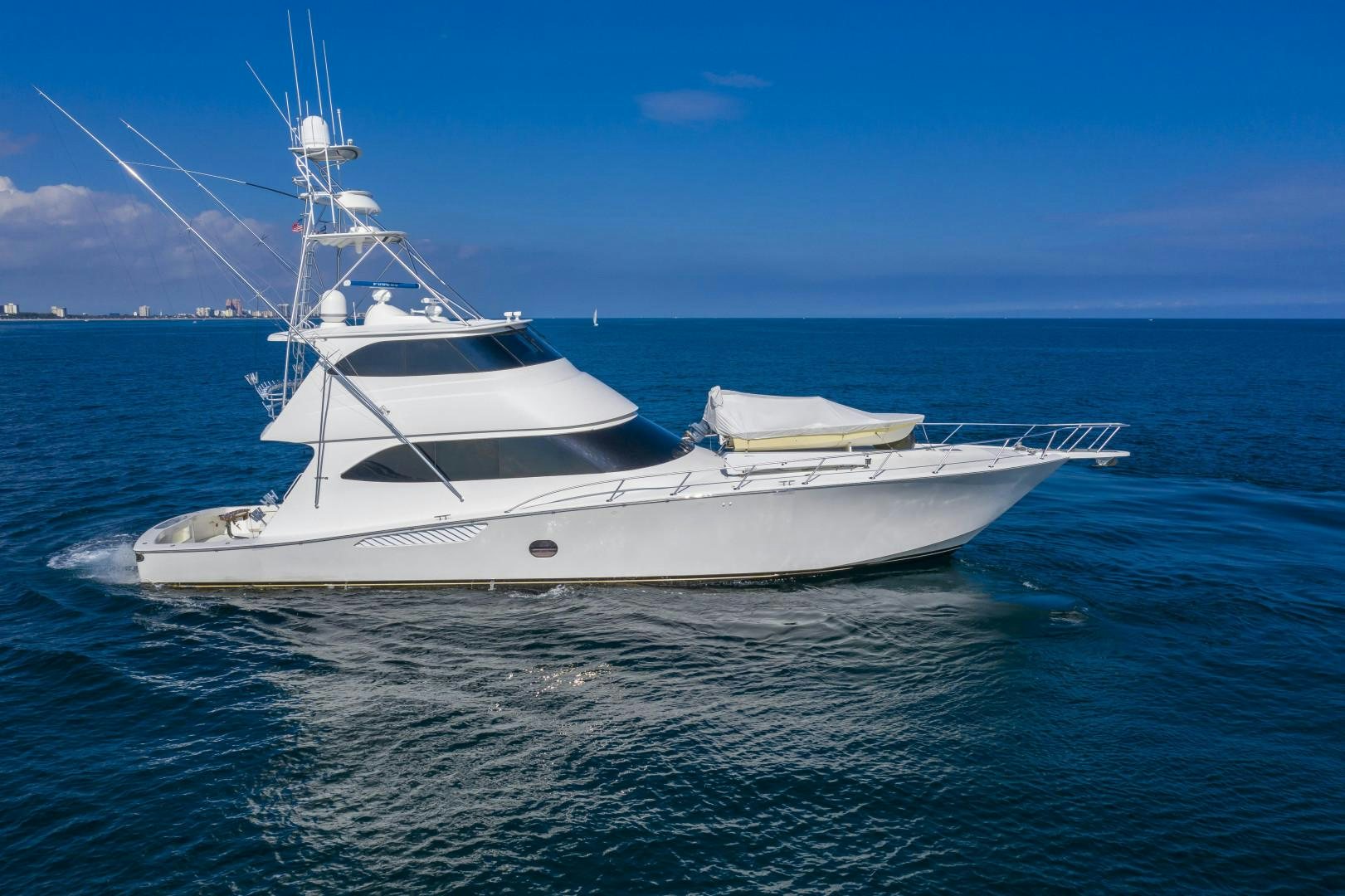 a white yacht in the water aboard OSH IT Yacht for Sale
