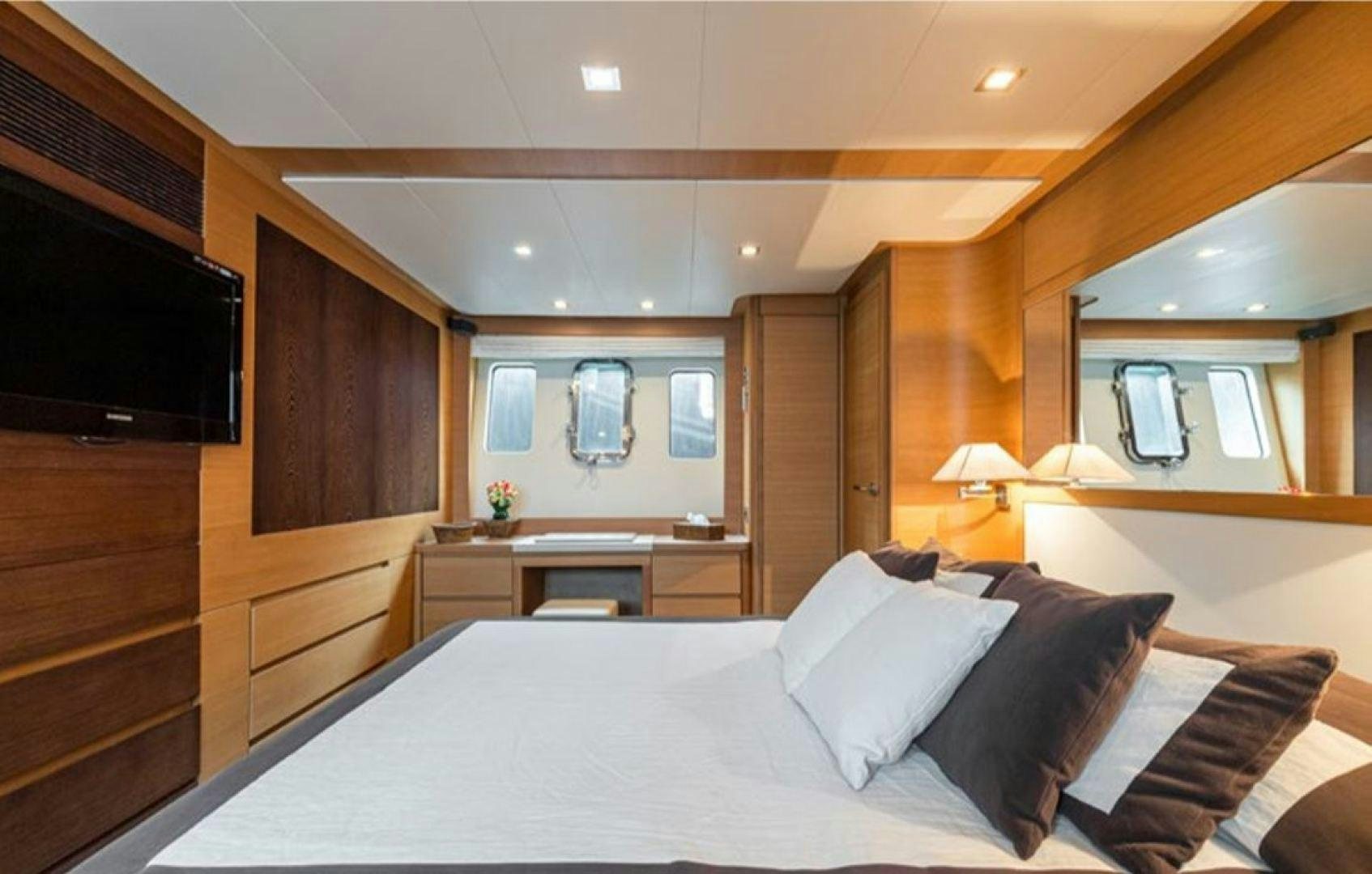 a large bed in a room aboard PASSION V Yacht for Sale