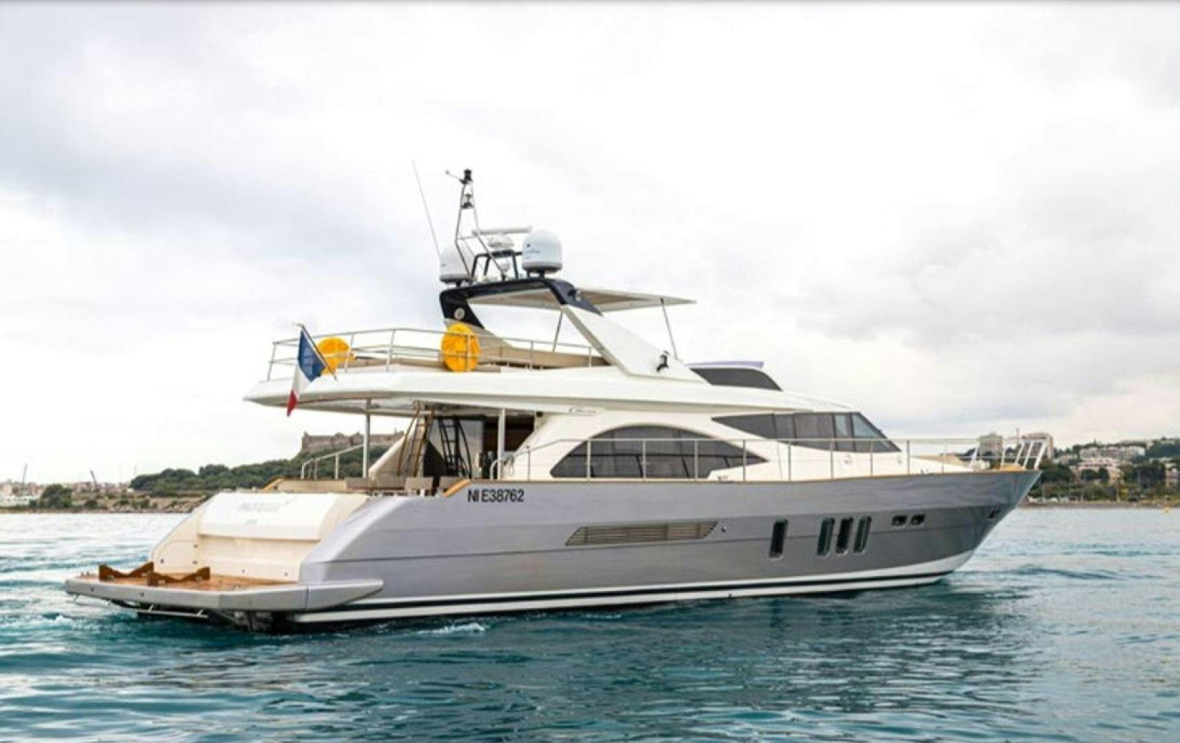 a white yacht on the water aboard PASSION V Yacht for Sale
