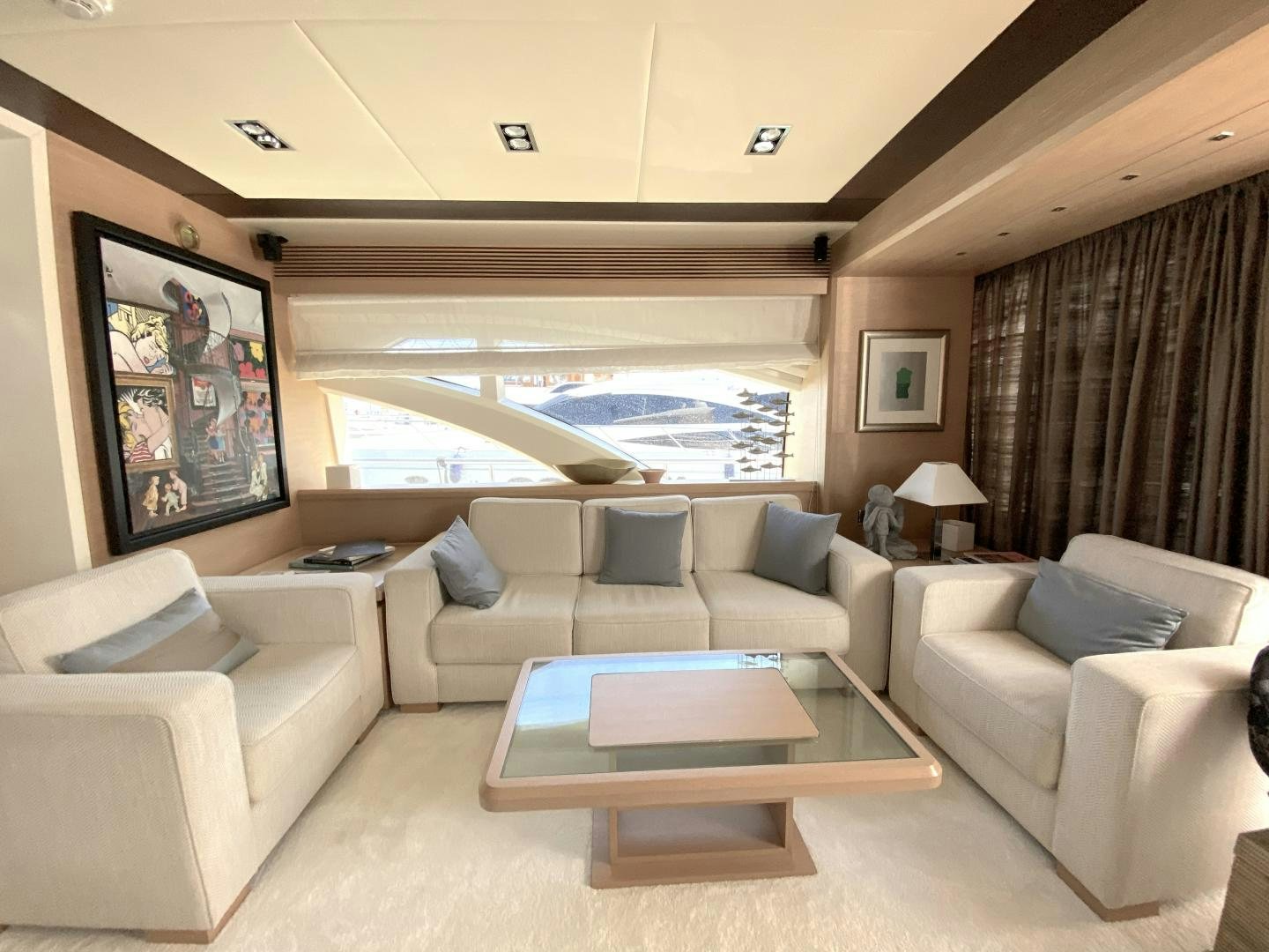 a living room with a large window aboard THOR Yacht for Sale
