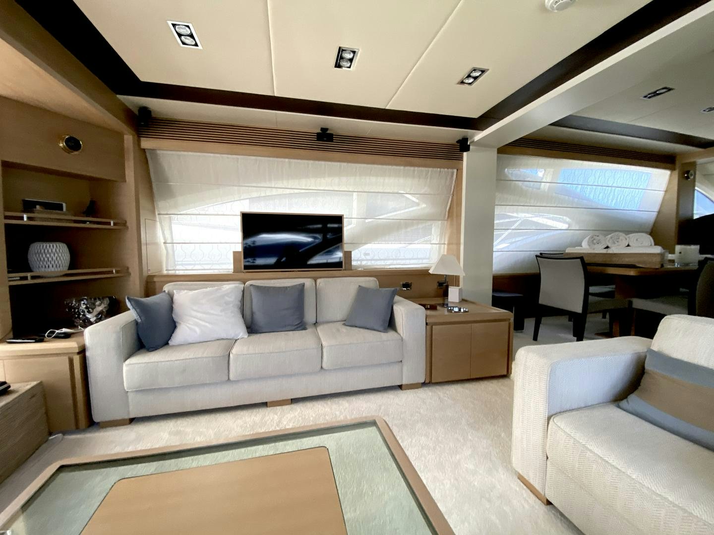 a living room with a couch and a tv aboard THOR Yacht for Sale