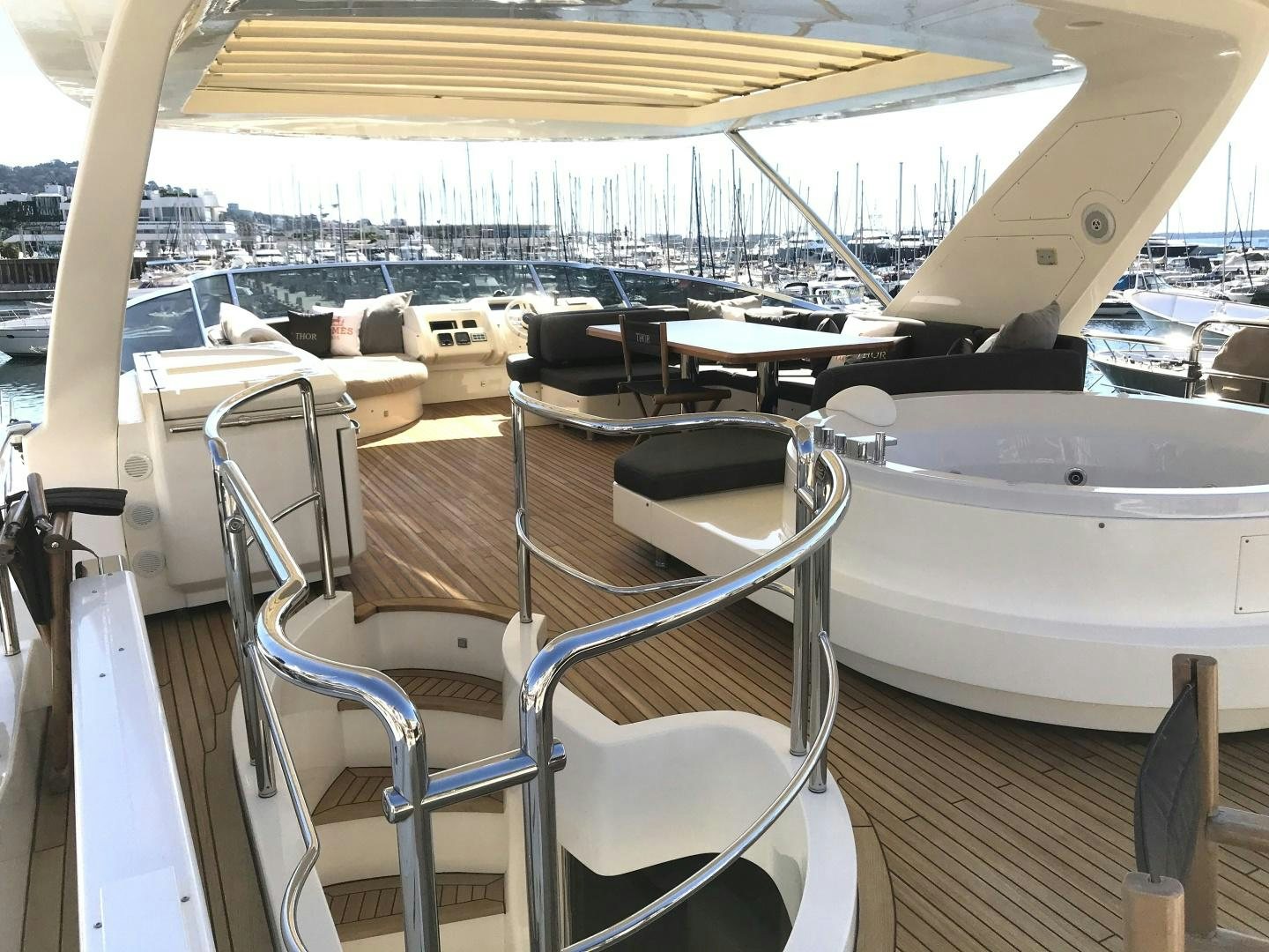 a boat with chairs and tables aboard THOR Yacht for Sale