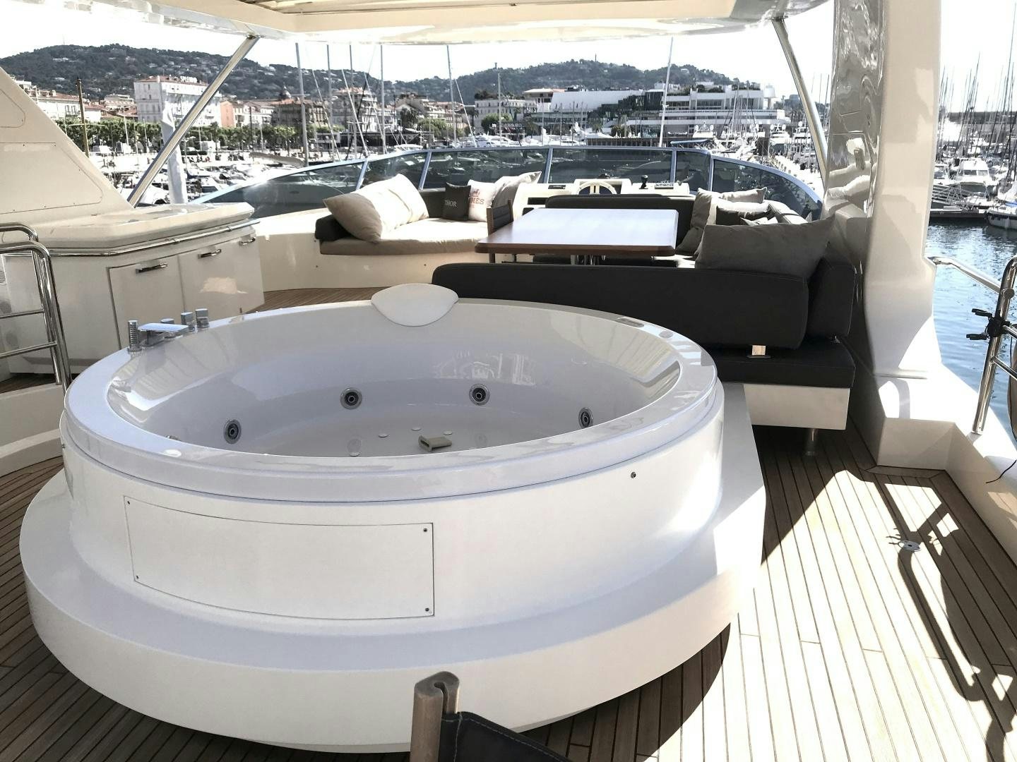 a large white boat on a deck aboard THOR Yacht for Sale