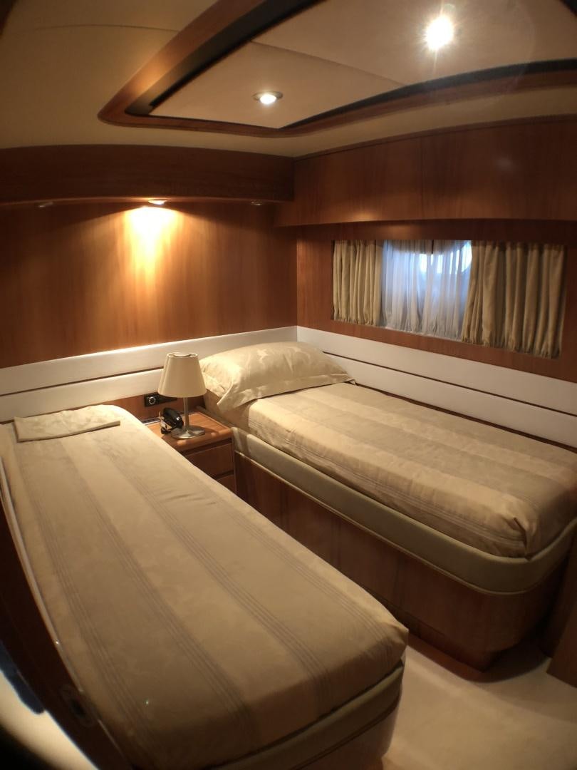 a room with two beds aboard LADY J II Yacht for Sale