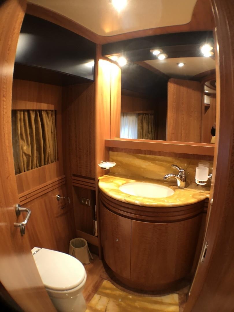 a bathroom with a sink and toilet aboard LADY J II Yacht for Sale