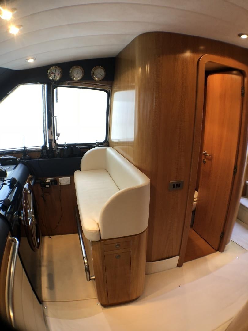a small bathroom with a toilet aboard LADY J II Yacht for Sale