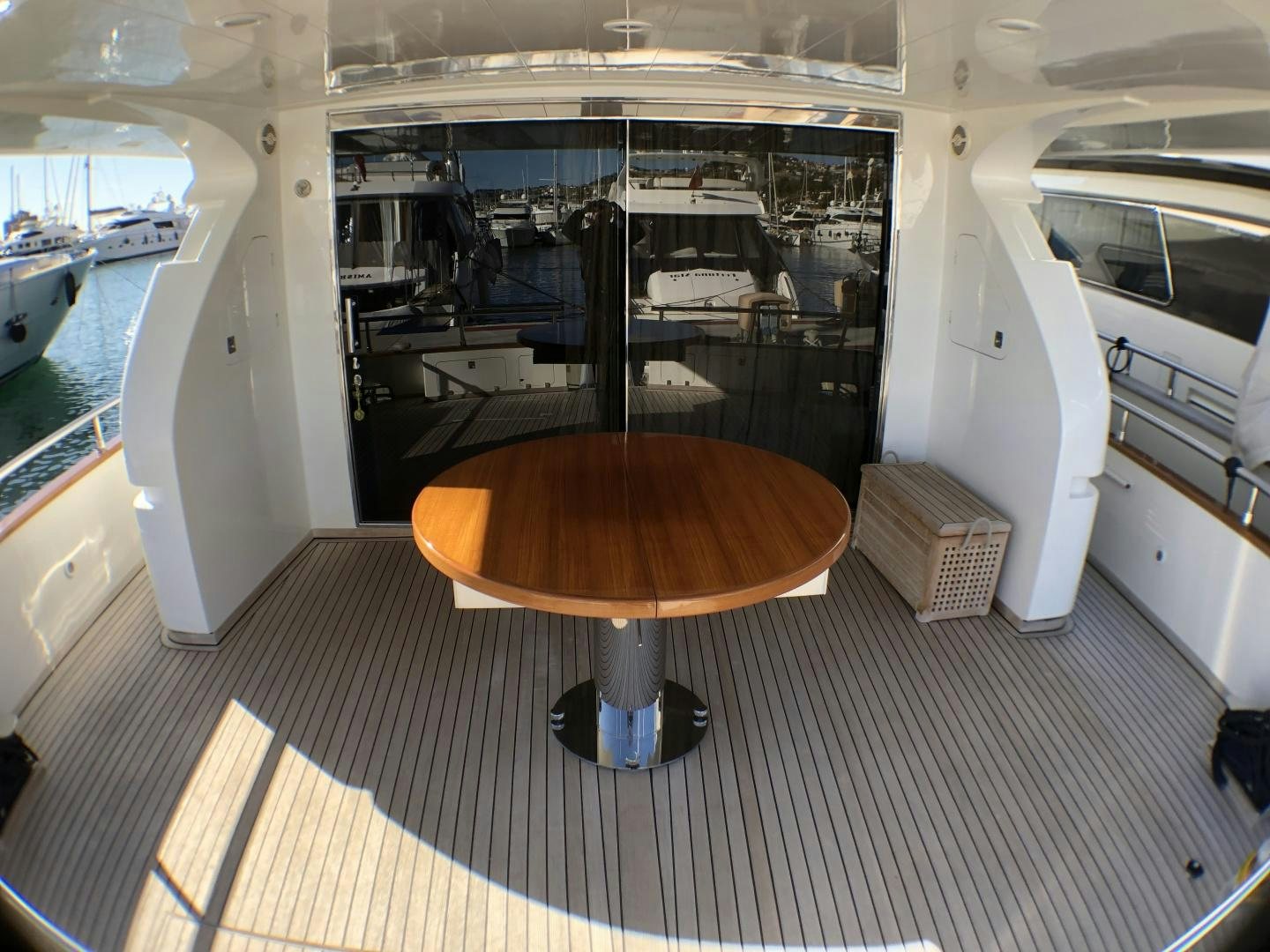 a round brown object on a black surface aboard LADY J II Yacht for Sale