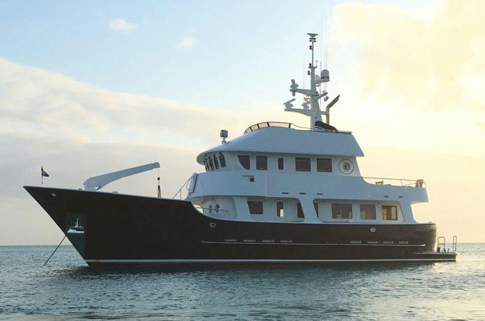 a large ship in the water aboard HERCULES Yacht for Sale